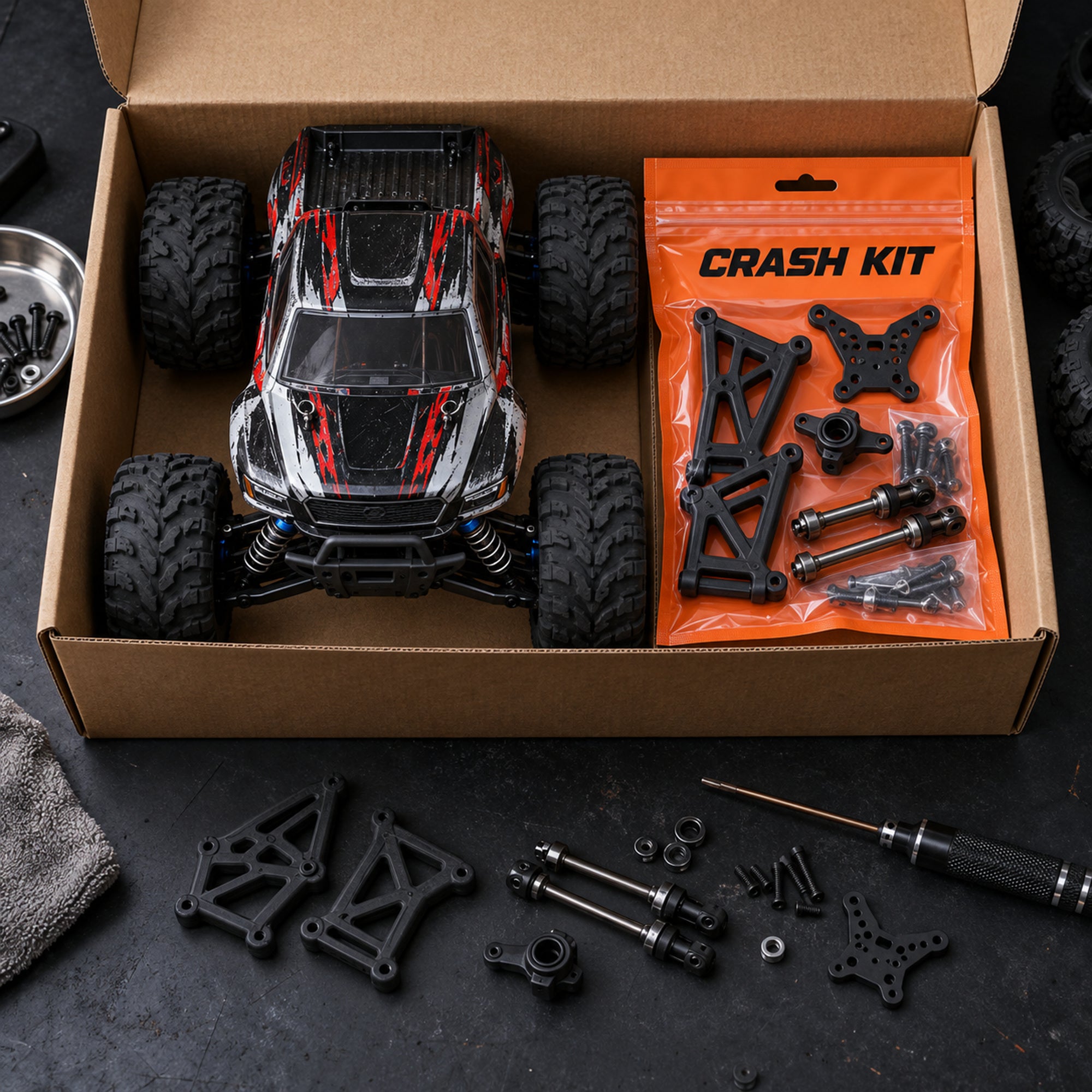 An RC buggy with an orange Crash Kit bag of spare parts